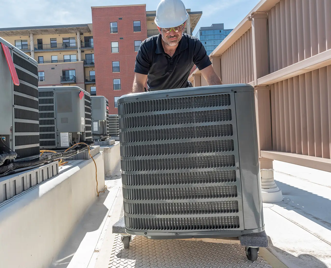 Premier Heating & Air HVAC Technician replacing old air conditioner with new air conditioner in springfield il