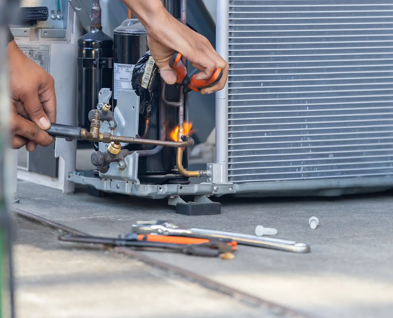 Premier Heating & Air HVAC Technician fixing common air conditioning problems in springfield il