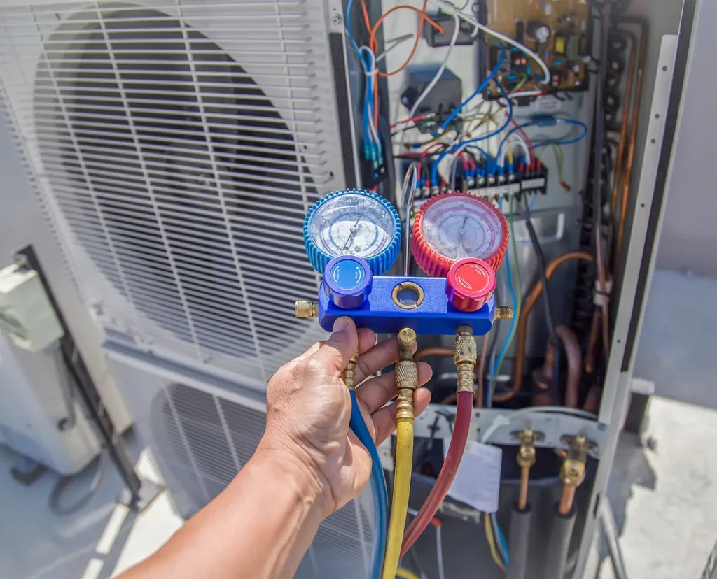 Premier Heating & Air HVAC Technician working on Emergency AC Service in springfield il